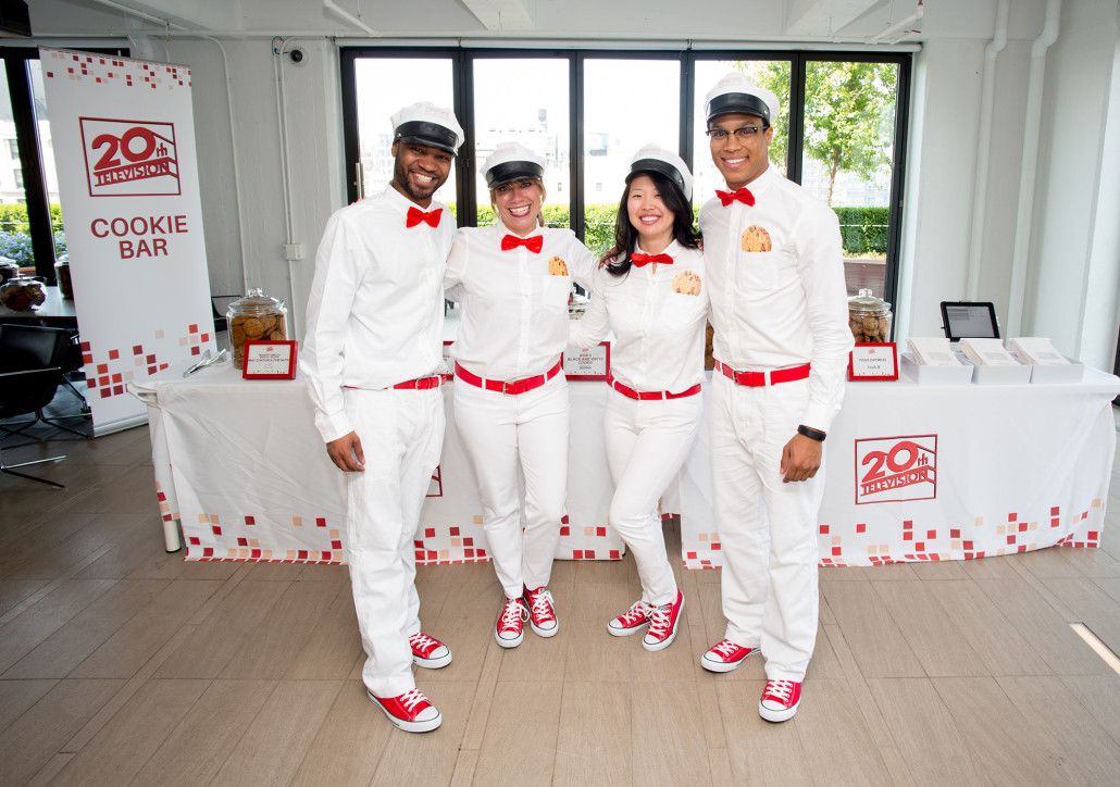 Brand Ambassadors dressed as modern "milk men" while serving milk and cookie shots and assisting employees with filling their cookie bags.