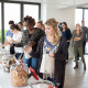 Agency employees enjoy milk and cookie shots while selecting various cookies for their cookie bag at the Twentieth Television Milk & Cookie Bar.