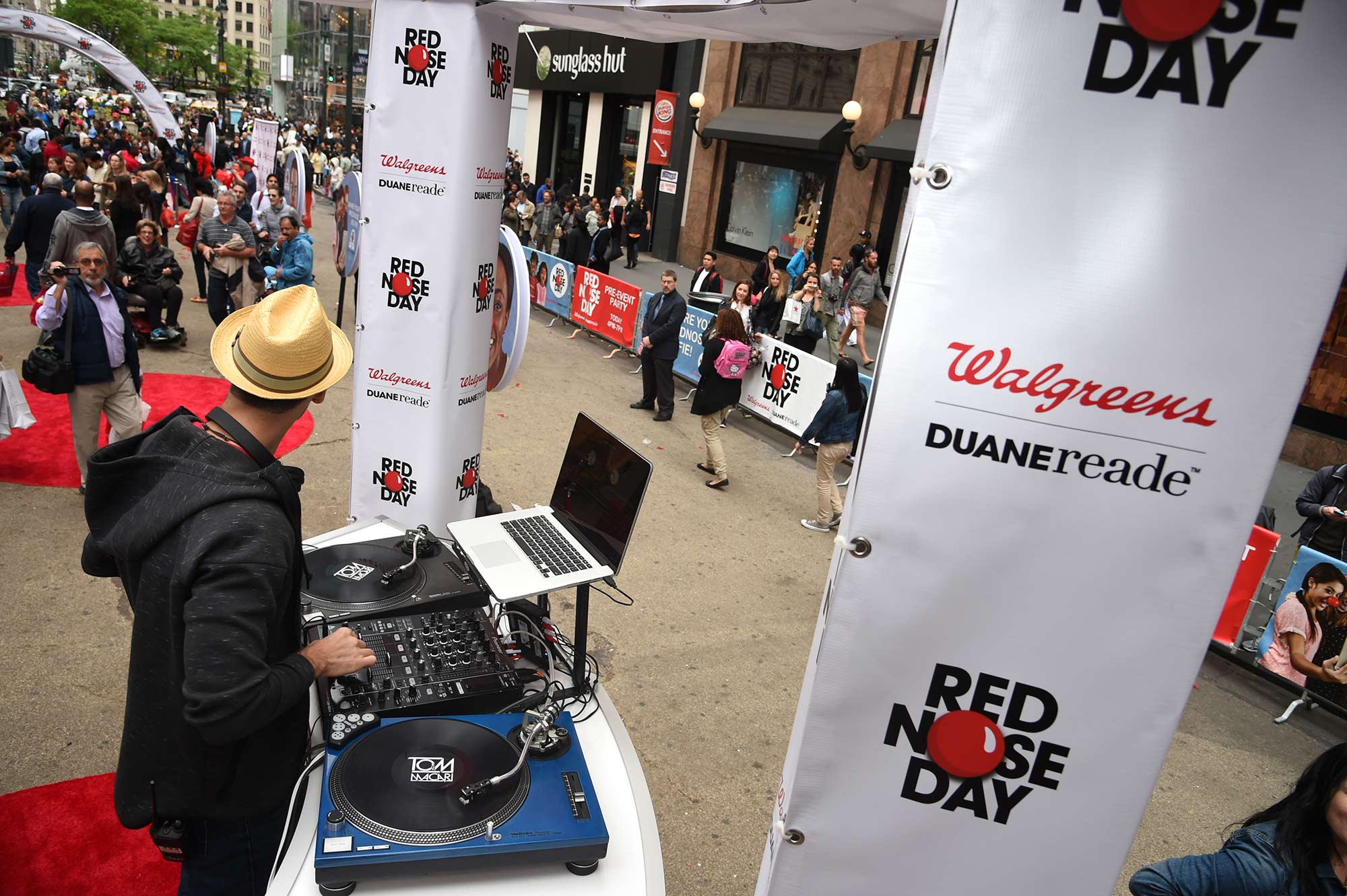 The DJ at Duane Reade's Red Nose Day Pre-Event Party prepares to spin away as guests arrive.