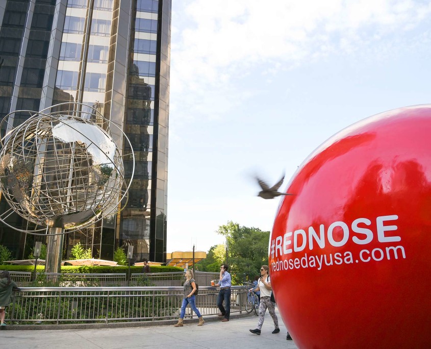 One of 5 larger-than-life Red Nose statues sits proudly in New York City's Columbus Circle.