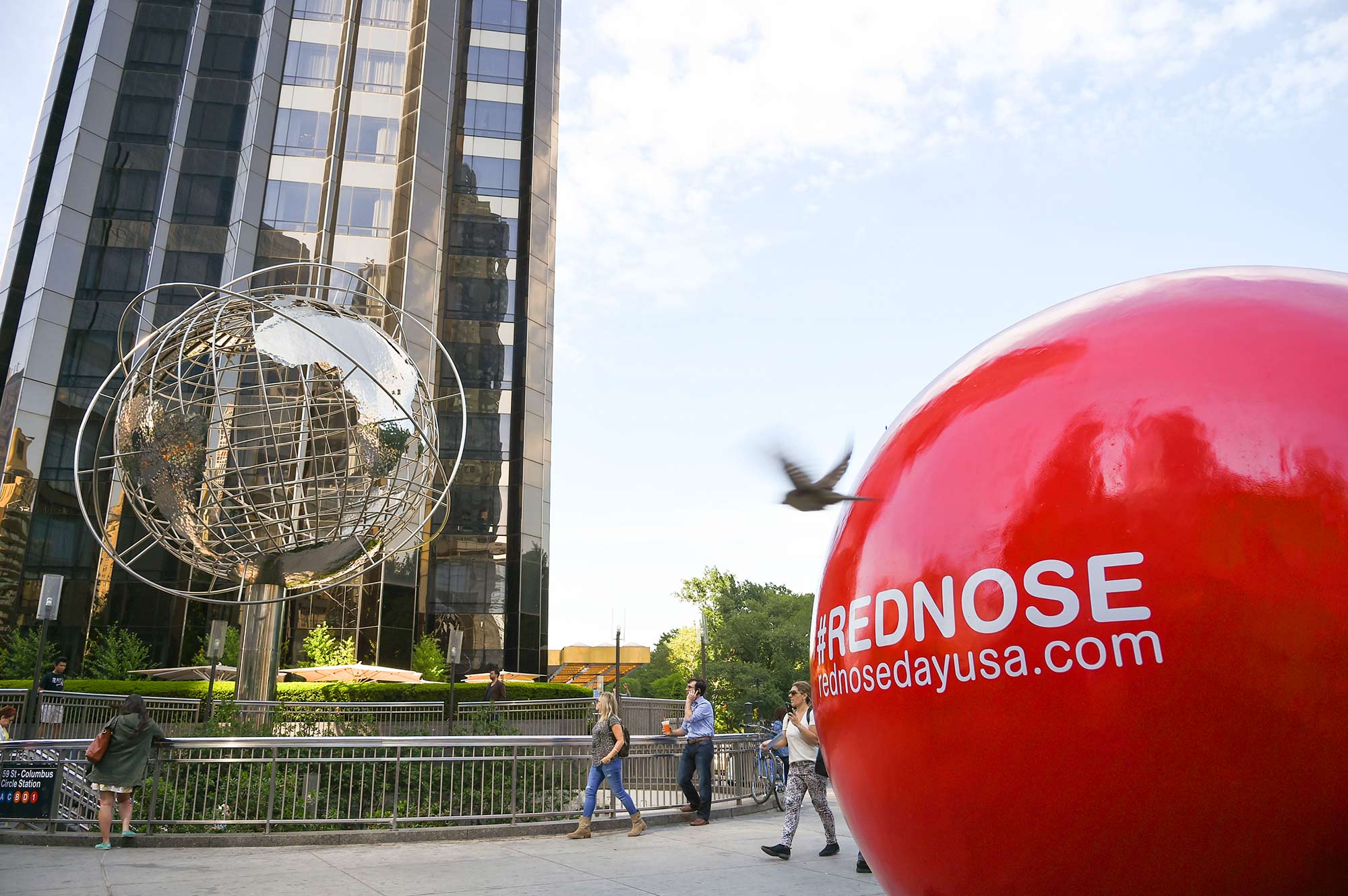 One of 5 larger-than-life Red Nose statues sits proudly in New York City's Columbus Circle.