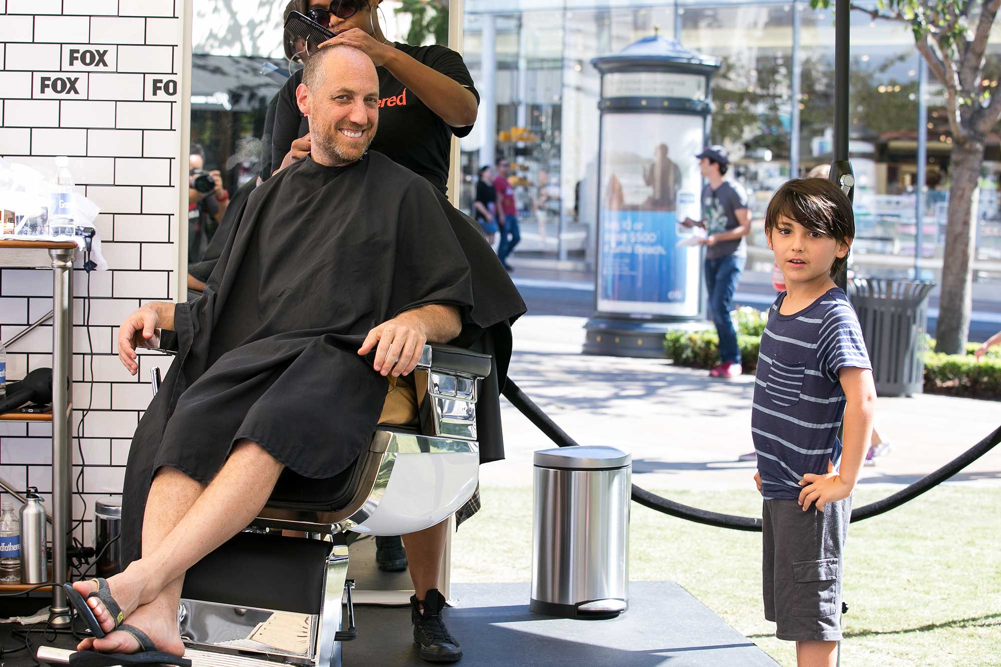 A young guest waits for a free style from the Rudy's Barbershop team.