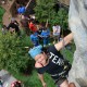 A participant climbs the rock wall at History Channel's Mountain Men City Trek in New York City's Union Square.