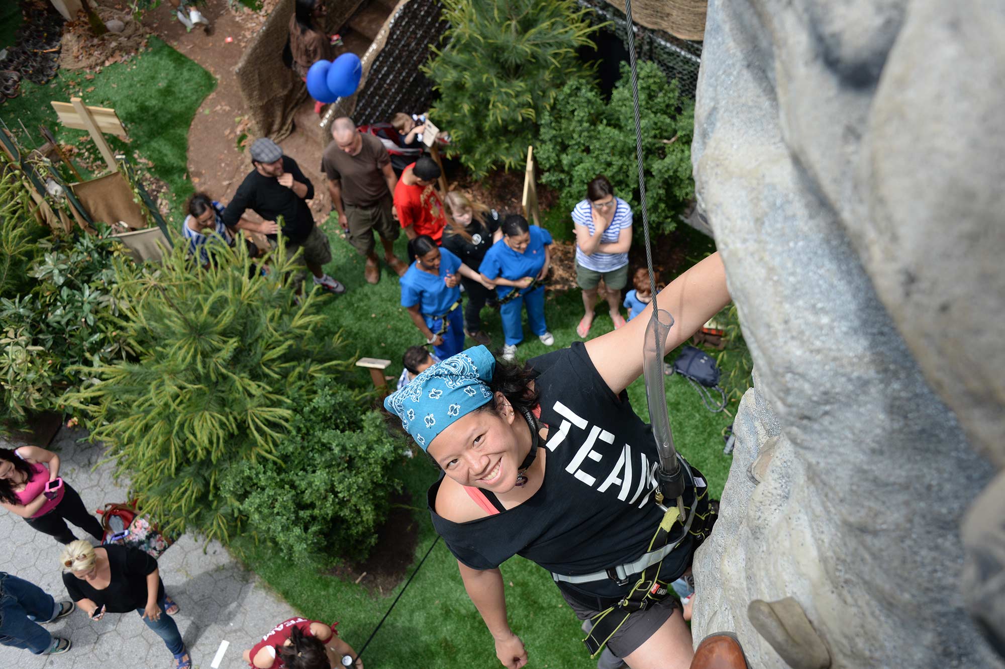 A participant climbs the rock wall at History Channel's Mountain Men City Trek in New York City's Union Square.