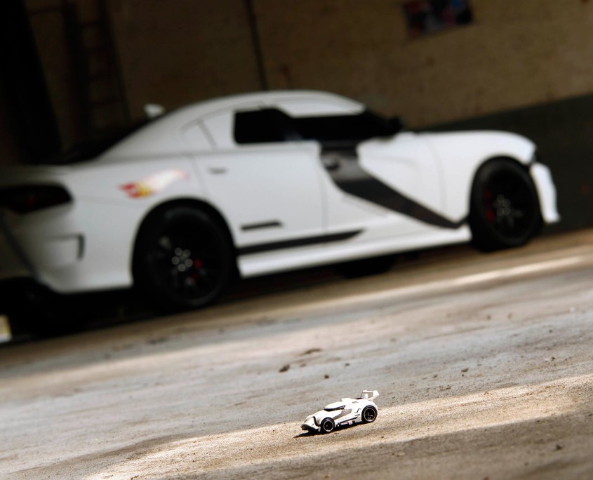 The Hot Wheels Stormtrooper toy car looks tiny compared to the Dodge SRT wrapped to look exactly like it.