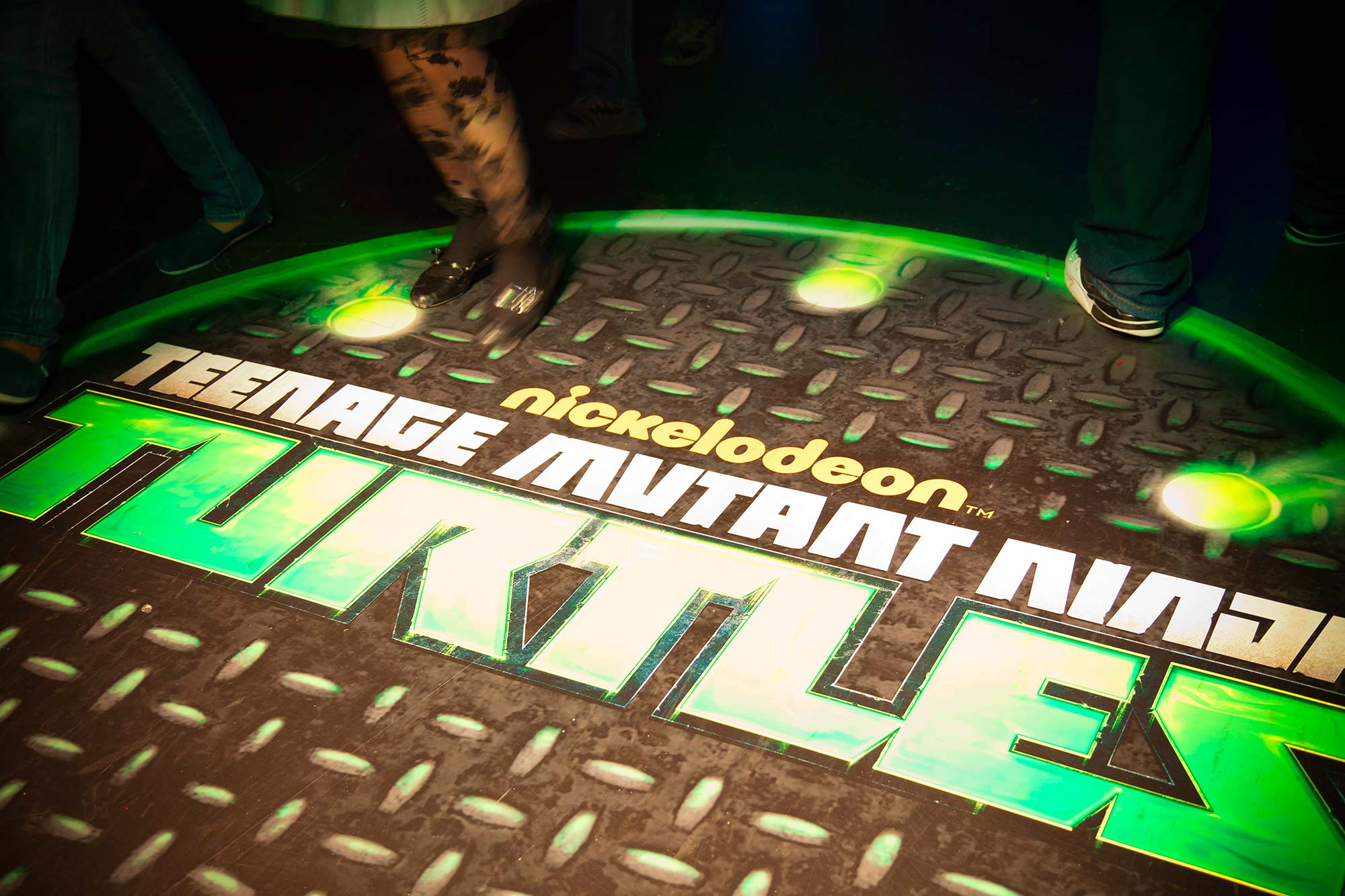 Branded manhole covers greeted guests as they stepped into the immersive experience of Nickelodeon's Teenage Mutant Ninja Turtle hallway.