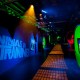Lighting effects on the floor of the TMNT hallway resemble sewer grates, further enhancing the effect of being inside the Turtles' lair.