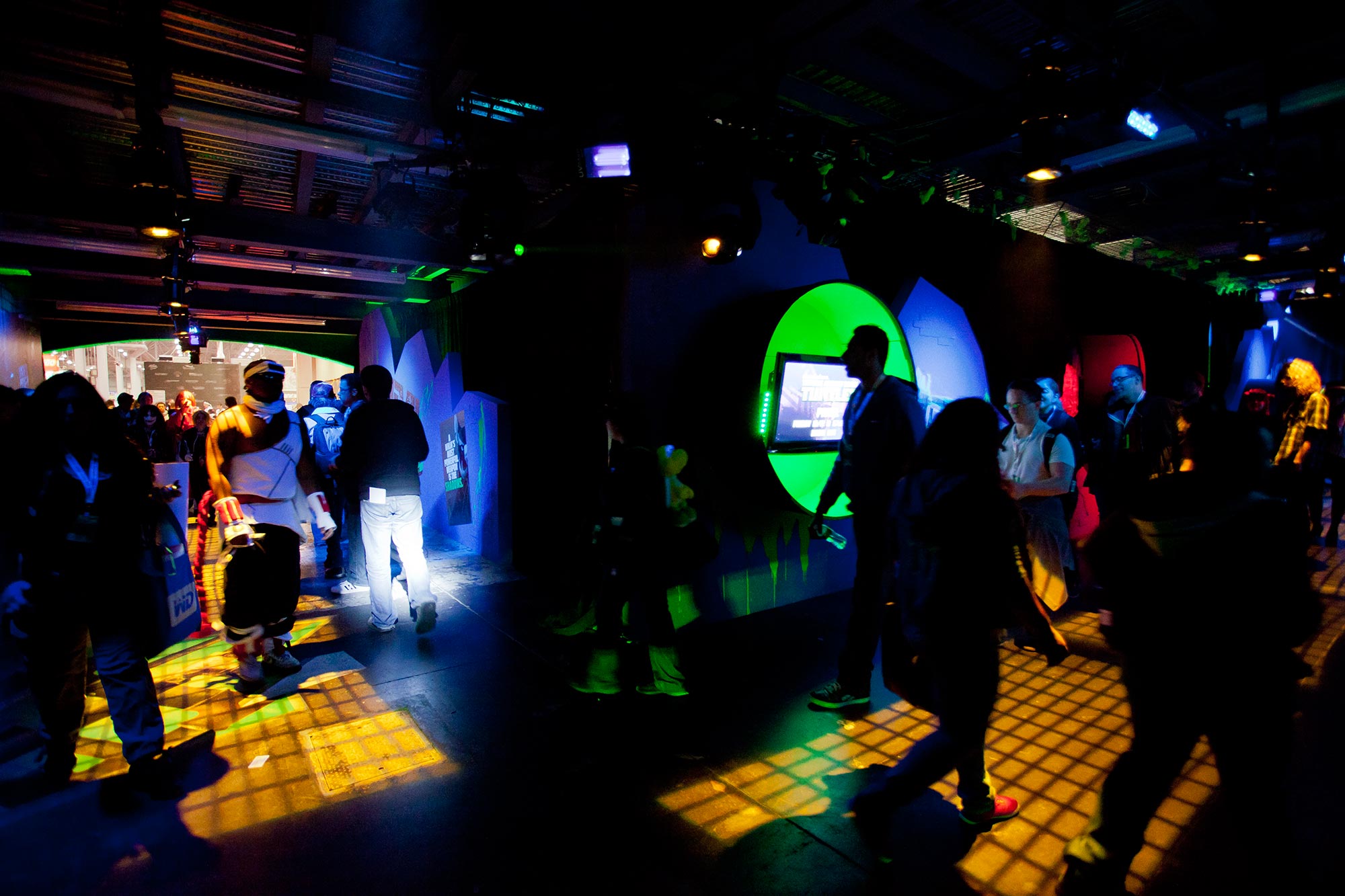 Guests in the TMNT hallway enjoy exclusive content from the Nickelodeon show by peering into sewer tubes.