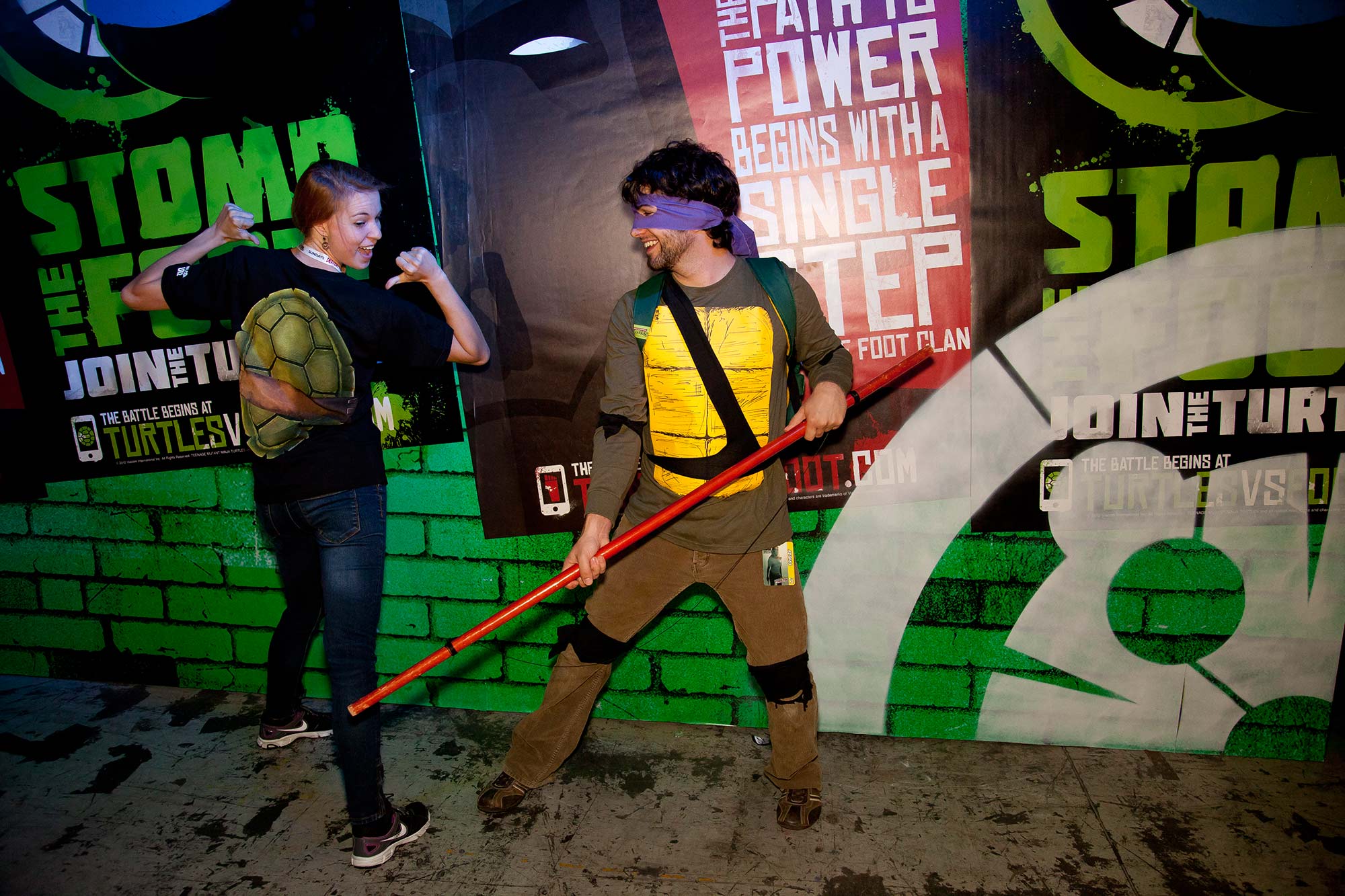 Fans pose inside the TMNT lair at New York Comic Con.