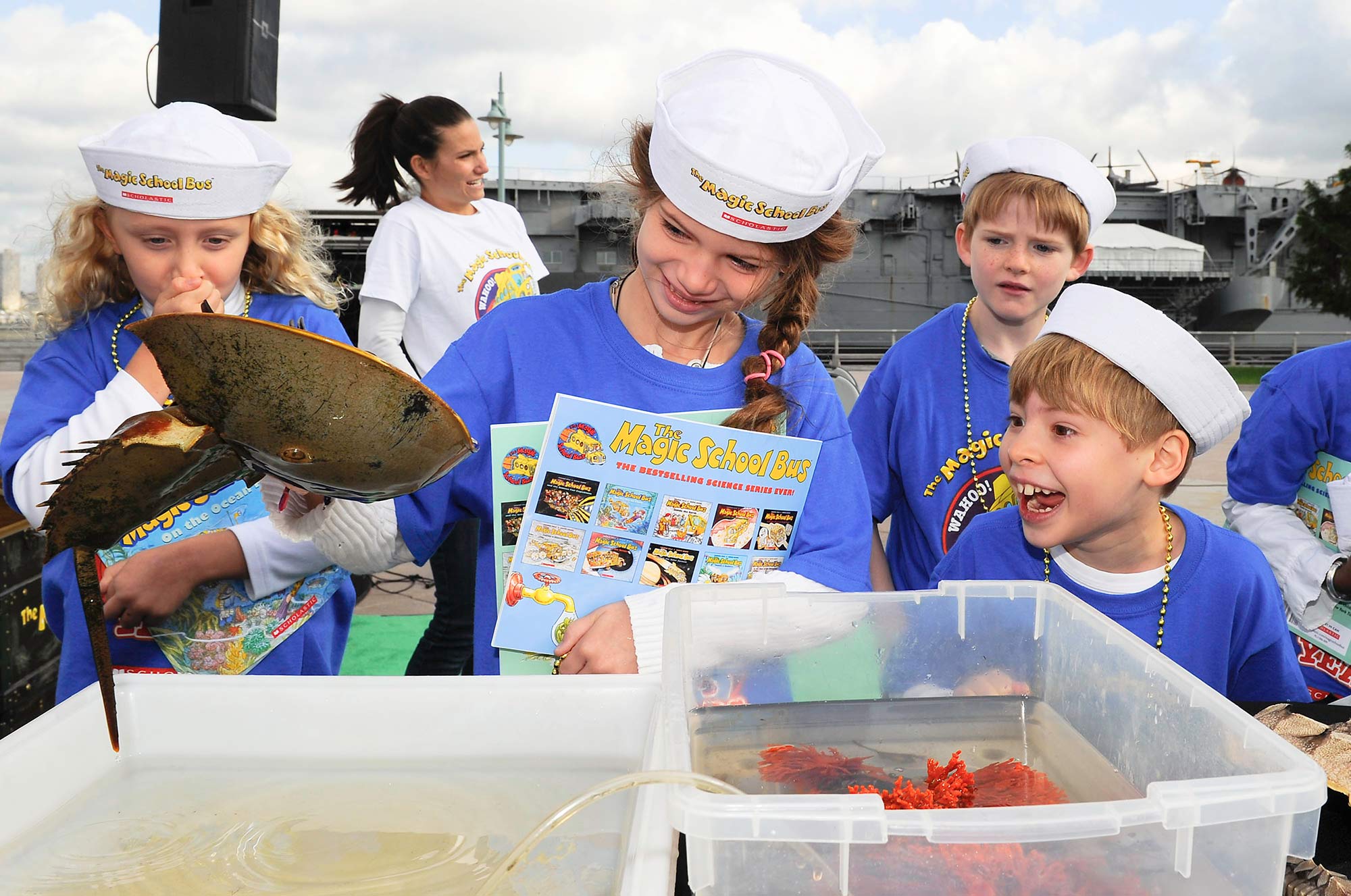 Students from the United Nations International School enjoy a lesson on aquatic life from Dr. Meryl Kafka, former curator for the New York Aquarium.