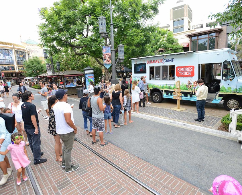 Guests line up to order their own gourmet s'more from the Summer Camp S'mores Truck, promoting the USA network's reality competition series.