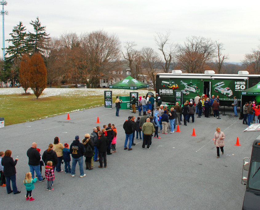 Loyal fans of the Hess brand wait in line for their peek inside the mobile museum at the full collection of the Hess Toy Trucks.