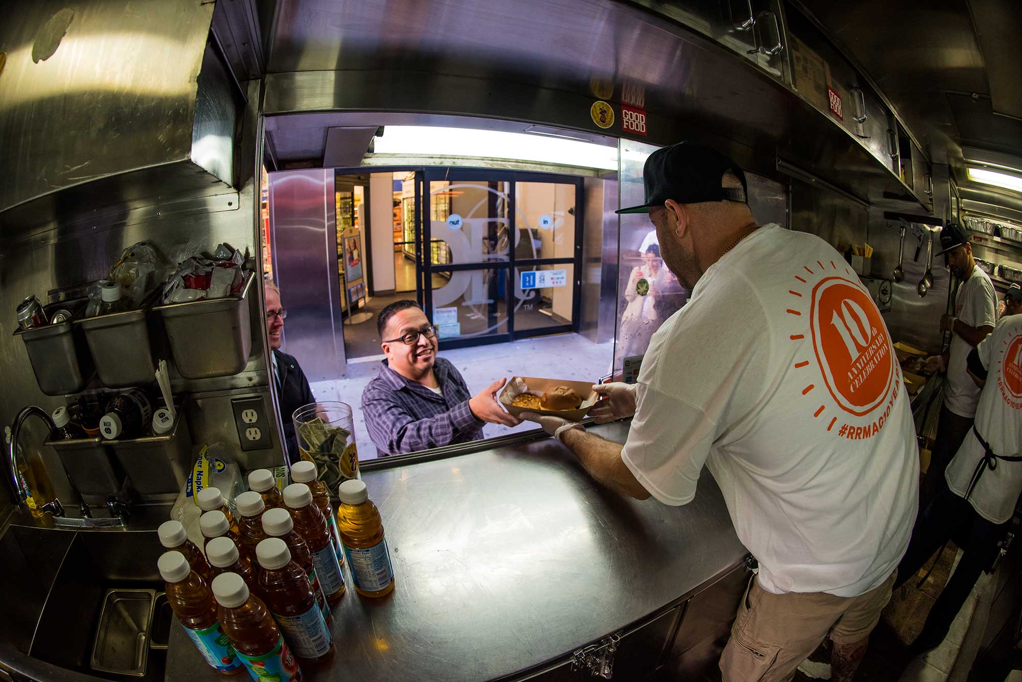 Brand Ambassadors serve up delicious burgers from the food truck in celebration of the 10 year anniversary of Rachel Ray Every Day.